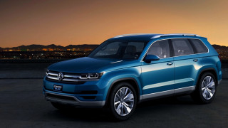 Blue volkswagen suv city sunset - a parking lot free wallpaper