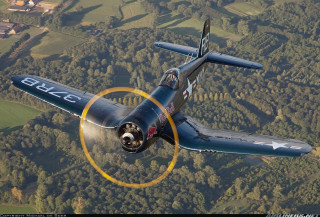 Airplane flying forest hillside yellow - a yellow circle free wallpaper