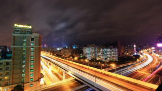 City skyline freeway bridge nighttime - long exposure free wallpaper
