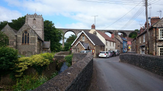 Street bridge clocktower building cars - a bridge and a building free wallpaper