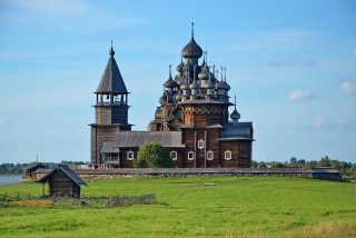 Large wooden church tower field - two tower free wallpaper
