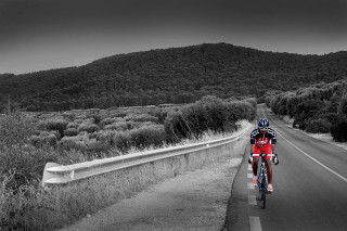 Man riding bike road green 2 - great composition free wallpaper