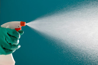 Green gloves sprayer blue wall - a blue wall free wallpaper