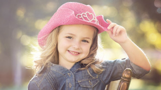 Little girl pink hat smiling 2 - a little girl free wallpaper