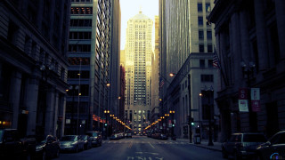 City street tall buildings traffic 2 - a sky line in the background free wallpaper