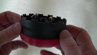Person holding small tool with - crown free wallpaper