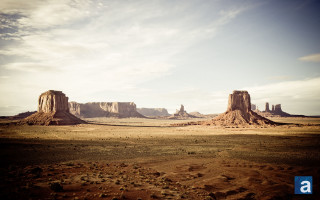 Desert landscape rocks sky clouds - a desert landscape free wallpaper