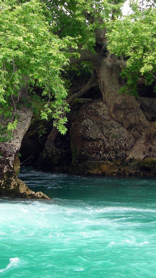 Man kayaking river rock formation - free nature wallpaper
