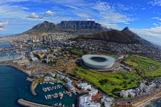 Stadium city mountains water background - a large stadium free wallpaper