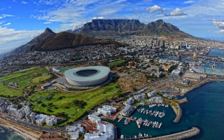 Stadium city mountains background water - a large stadium free wallpaper