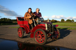 Old fashioned car ride reflection - two person free wallpaper
