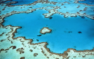Blue ocean water rocks sand - bottom free wallpaper