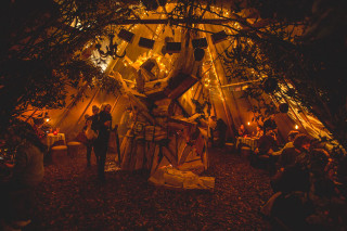 Group tent lights statue man - a statue of a man free wallpaper