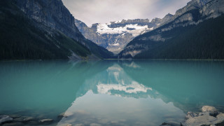 Mountain range reflection lake rocks 10 - a mountain range in the background free wallpaper