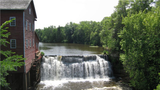 Waterfall river trees red building - a red building free wallpaper