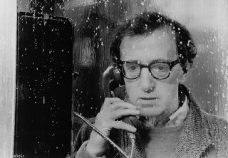 Man glasses talking phone window - a speaker free wallpaper