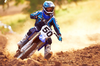 Dirtbike rider dirttrack trees motionblur - a man riding free wallpaper