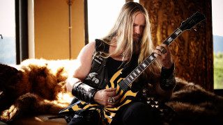 Man longhair blackshirt playing guitar - alex petruk ape free wallpaper