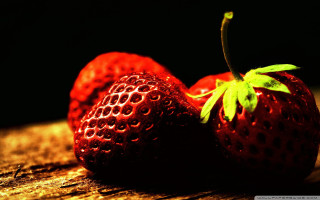 Strawberries wooden surface green leaf 2 - top of them free wallpaper