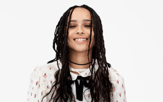 Woman dreadlocks white shirt smiling - a white background behind her free wallpaper