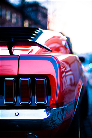 Red sports car parked side - the side of the road free wallpaper
