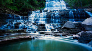 Waterfall blue pool rock forest - a blue pool in the middle of it free wallpaper