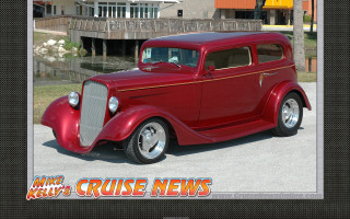 Red car parked building cruise - digital free wallpaper for desktop