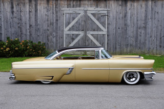 Classic car parked wooden fence - a classic car free wallpaper