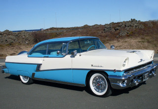 Blue white car parked hill - erlund hudson free wallpaper