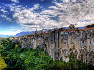City tall wall mountain clouds - correggio free wallpaper