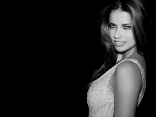 Woman white top posing dark - a pony tail free wallpaper