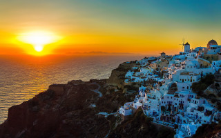 Sunset village cliff ocean windmill - a cliff free wallpaper for desktop