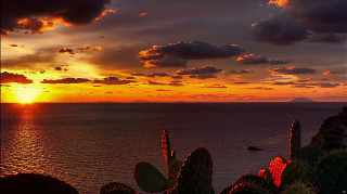 Sunset water boat mountain clouds - a sunset over a body of water free wallpaper