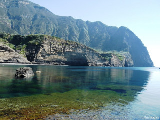 Water mountain rock outcropping scenery - a body of water free wallpaper for desktop
