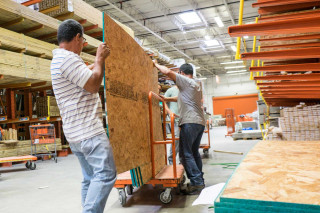 Men working wood warehouse pallets - a warehouse free wallpaper