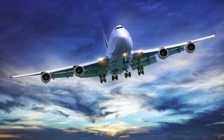 Jetliner flying cloudy sky sunset - free airplane wallpaper