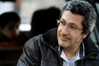 Man glasses sitting car serious - farid mansour free wallpaper