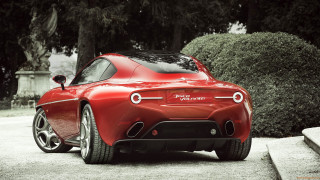 Red sports car stone wall - a bench in the background free wallpaper