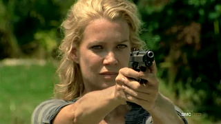 Woman holding gun serious look - carey morris free wallpaper