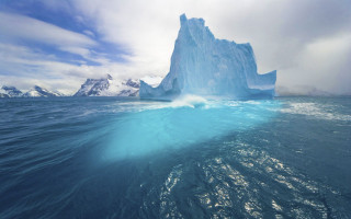 Iceberg mountain ocean sky beach - a mountain range in the distance free wallpaper