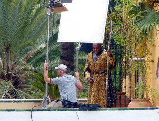Man filming man yellow dress - christopher perkins free wallpaper
