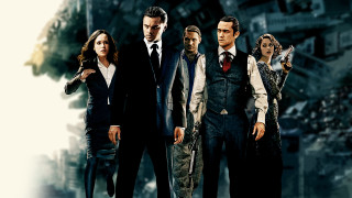 Group people cityscape gun man - their hand and a man in a suit free wallpaper