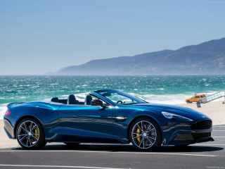 Blue sports car ocean beach - a pier in the background free wallpaper