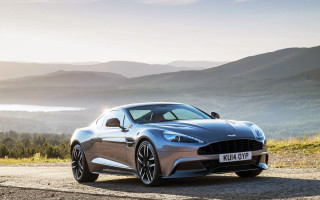 Silver car parked mountains water - a bright sun free wallpaper