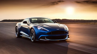 Blue sports car sunset road - the sun behind free wallpaper