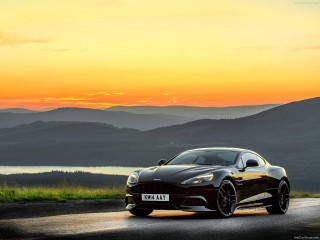 Black sports car mountain sunset - a road near a mountain range free wallpaper