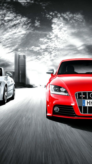 Cars driving road city skyline - a city skyline free wallpaper