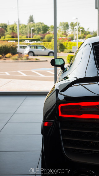 Black sports car parking lot 2 - a tilt shift photo free wallpaper
