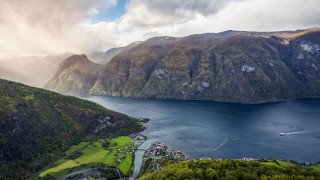 Scenic lake mountains forest boat - a scenic view of a lake free wallpaper