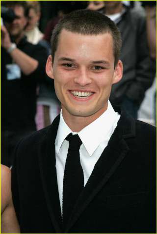 Young man smiling suit crowd - young free wallpaper